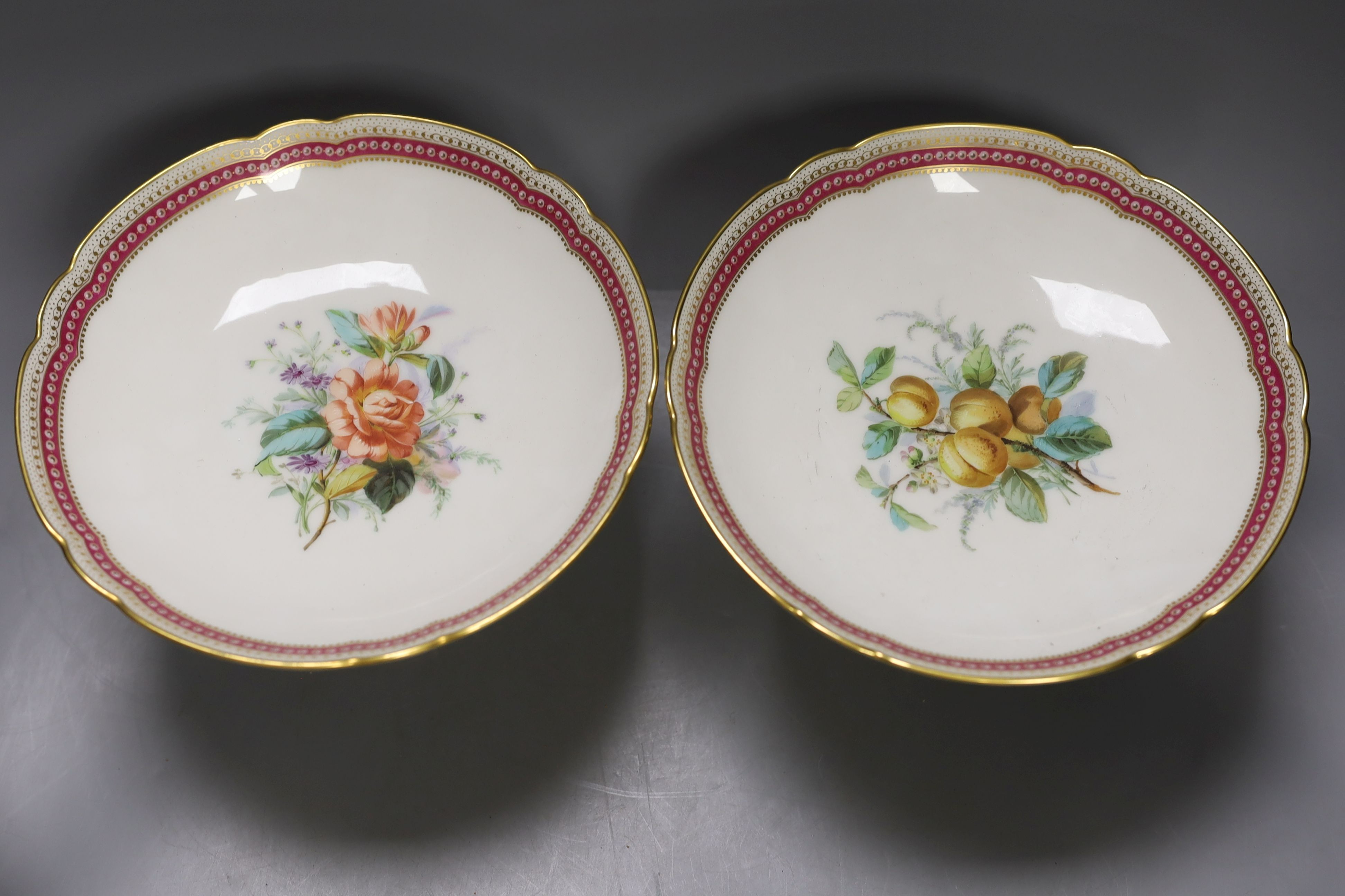 A late 19th century Paris porcelain floral part dessert service, with 2 pairs of comports, a three tier cake stand and eleven dishes.